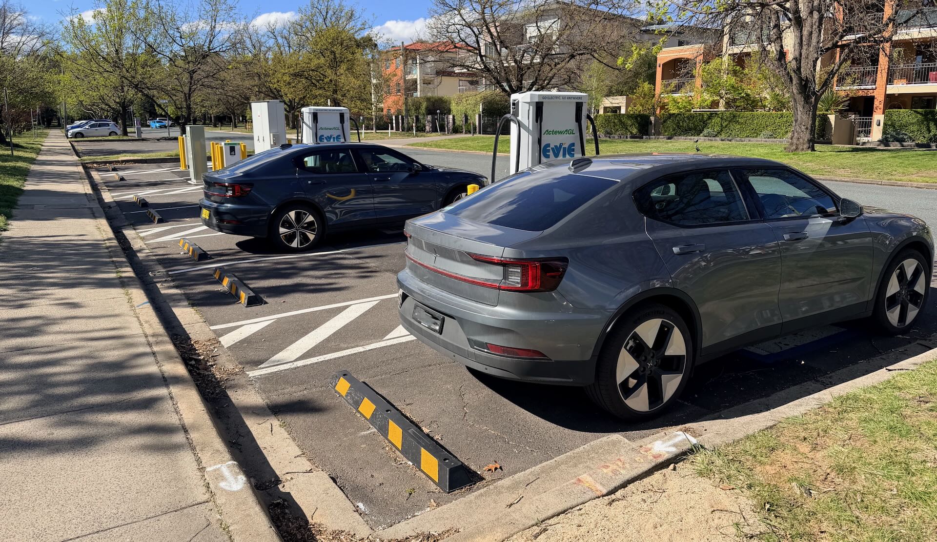 Two Polestar 2s drinking from the Evie charger in Canberra ACT