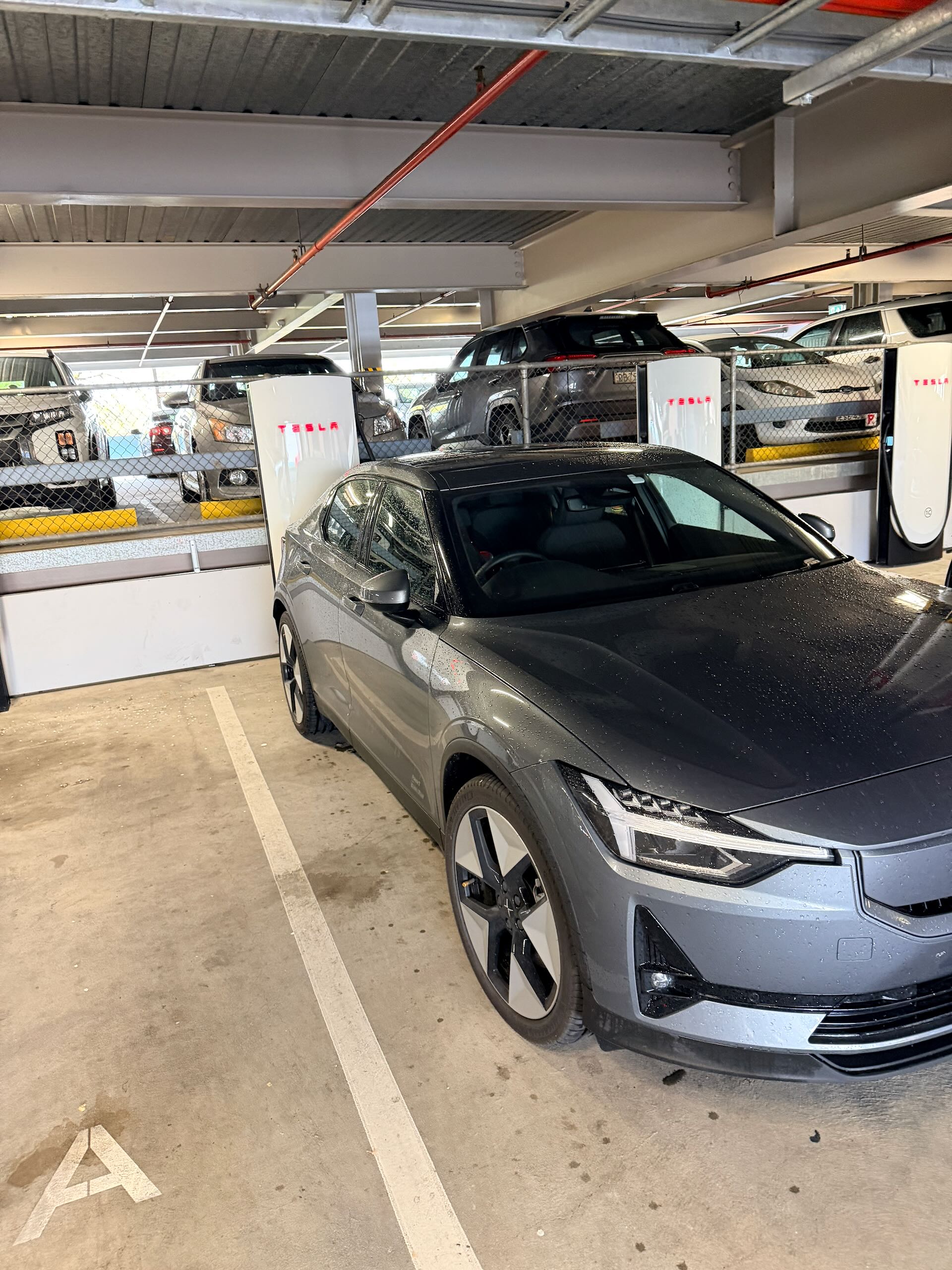 My Polestar 2 EV charging at a Tesla Supercharger in Albury, NSW